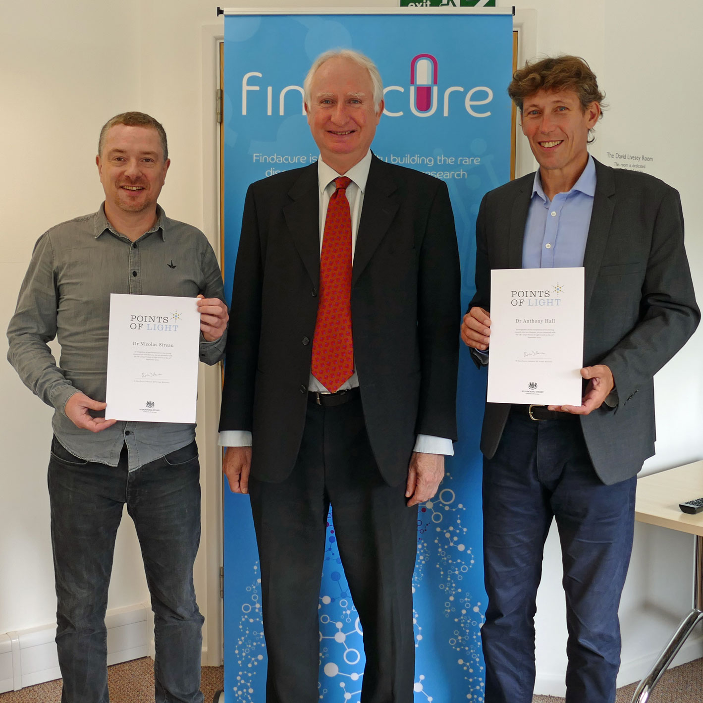 Photo of Tony Hall and Nick Sireau being awarded their point of light certificates by Daniel Zeichner MP for Cambridge