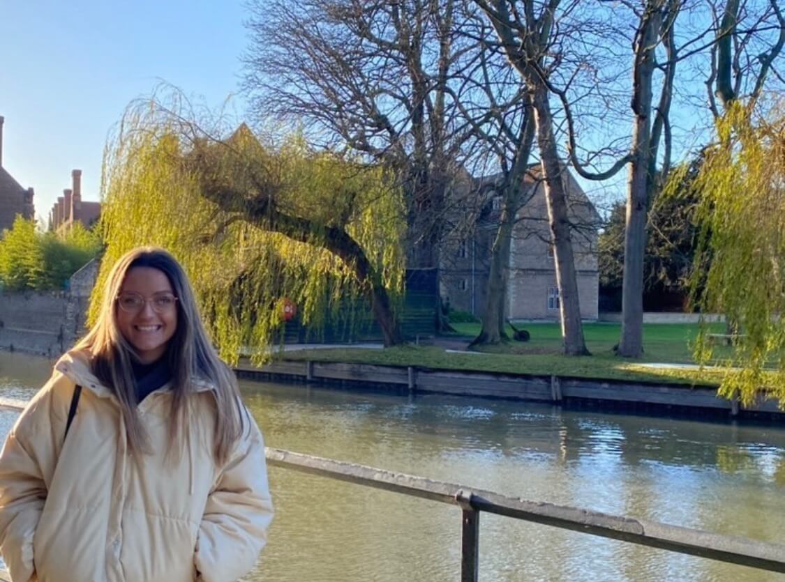 Photo of Faith in Cambridge standing next to the River Cam