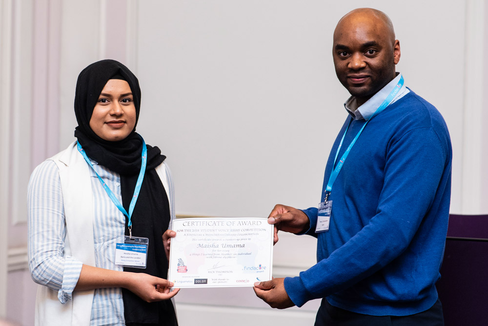 Previous SVP winner receiving certificate at conference