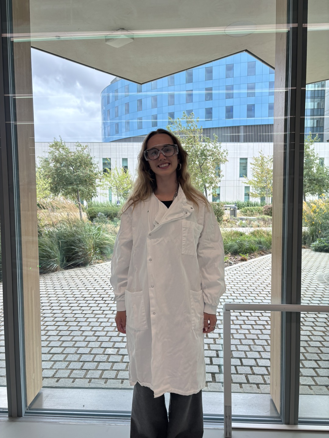 Photo of Ellie in lab coat