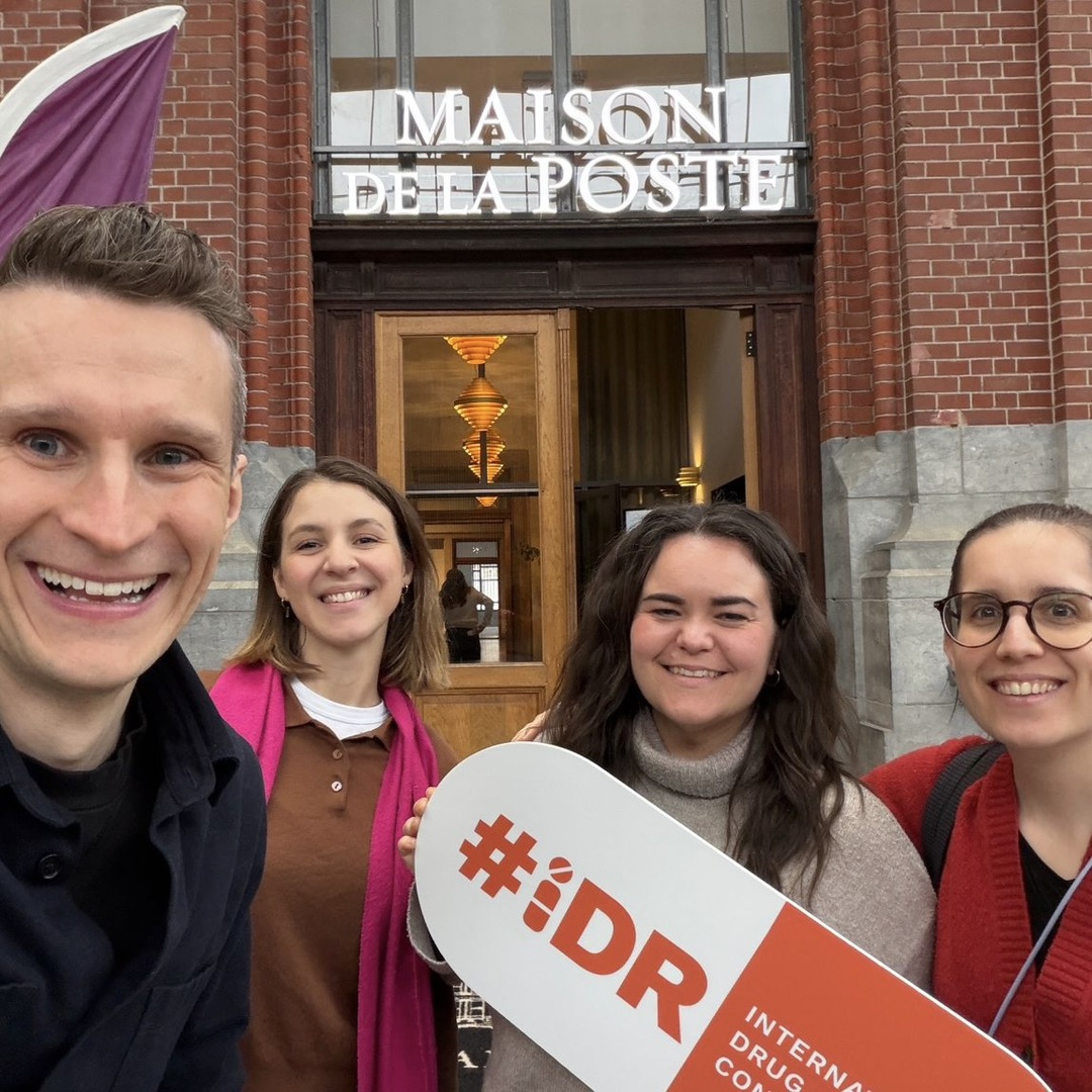Selfie of Mary Rose, Jake, Nikoletta, and Ivette. They are smiling outside of the venue.